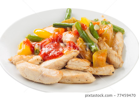 chicken pieces fried with vegetables on a plate, with ketchup, white background chicken pieces fried with vegetables on a plate, with ketchup, white background 77459470