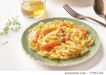 Pasta and wine, Italian dinner. Farfalle with smoked salmon and cream sauce 77461195