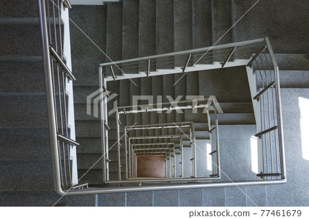 piral stairwell going down multiple flights 77461679