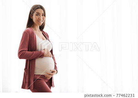 Healthy Pregnancy Concept. Portrait Of Beautiful Young Expectant Lady Posing At Home 77462231