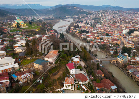 Aerial view of Kutaisi with Bagrati Cathedral on springtime dusk 77462678
