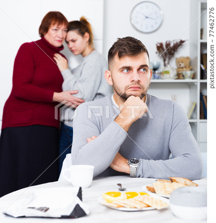 Upset man having problems in relationship with family Upset man having problems in relationship with family 77462776
