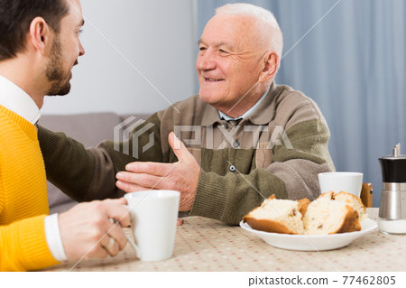 Elderly father and son breakfast 77462805