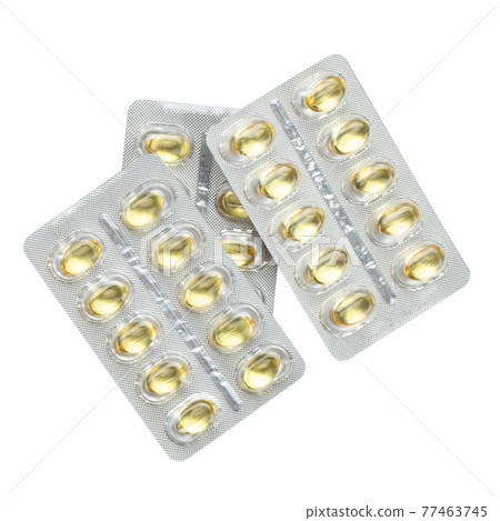 Blister pack of fish oil capsules isolated on white background. Blister pack of fish oil capsules isolated on white background. 77463745