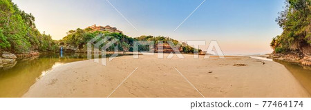 Lagoon with waterfall near Durban 77464174