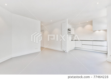 Spacious room with open kitchen furniture Spacious room with open kitchen furniture 77464228