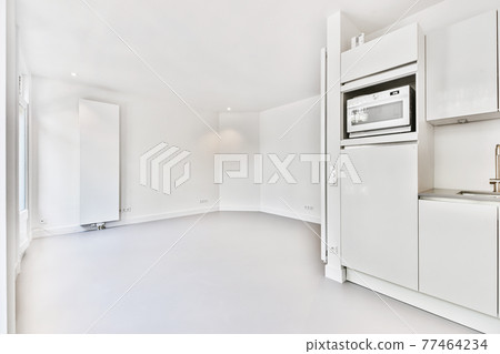 Spacious room with open kitchen furniture 77464234