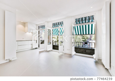 Light room with opened balcony doors in summer Light room with opened balcony doors in summer 77464239