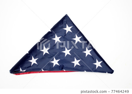 Folded flag of the United States on white background Folded flag of the United States on white background 77464249