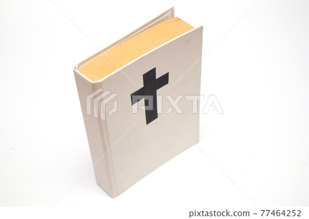 White book with a cross on the cover White book with a cross on the cover 77464252