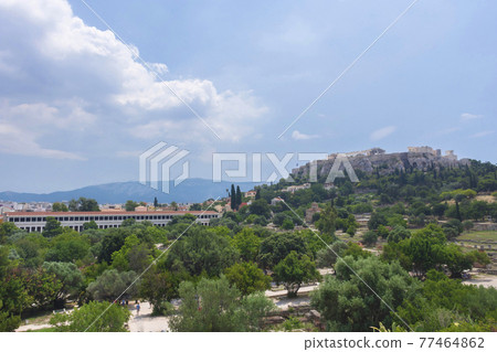 View of the Acropolis of Athens and Stoa of Attalos building with ancient greek ruins, famous tourist attraction in Greece, in sunny summer day View of the Acropolis of Athens and Stoa of Attalos building with ancient greek ruins, famous tourist attraction in Greece, in sunny summer day 77464862