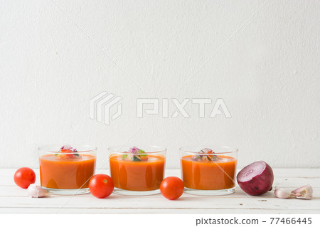 Gazpacho soup in glass on wood table 77466445