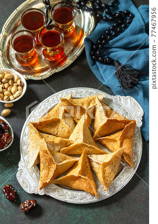 Arabic Cuisine. Ramadan Kareem Festive. Ramadan menu, arabian pancake katayef (katayev, qatayef) and dates, pistachio. 77467956