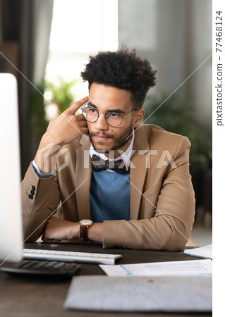 Pensive target specialist analyzing research data 77468124