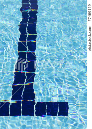 Crystal clear blue water of a swimming pool in summer, Spain. Crystal clear blue water of a swimming pool in summer, Spain. 77469139
