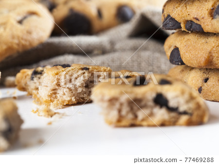 cookies with chocolate pieces inside, closeup food for desserts cookies with chocolate pieces inside, closeup food for desserts 77469288