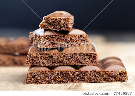divided into pieces chocolate bar divided into pieces chocolate bar 77469897