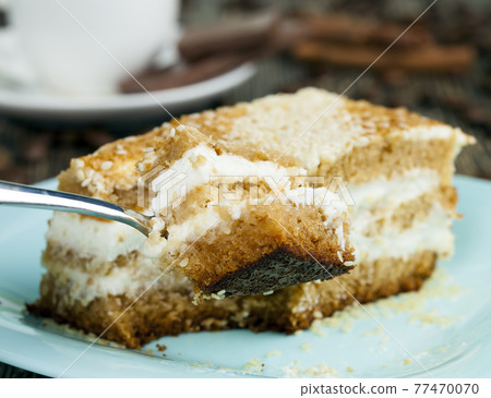delicious cake cut into pieces delicious cake cut into pieces 77470070