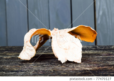 citrus peel on an old wooden table 77470127