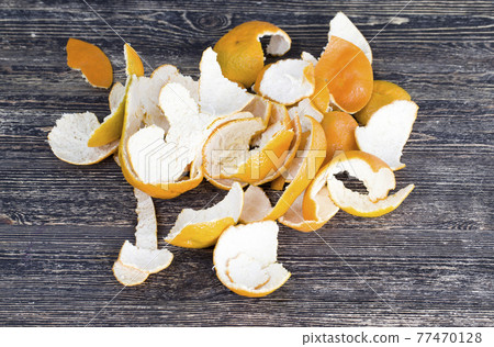 citrus peel on an old wooden table citrus peel on an old wooden table 77470128