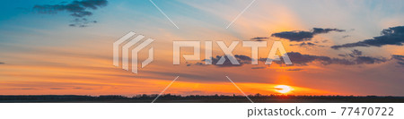Sunset Sunrise Over Field Or Meadow. Bright Dramatic Sky And Dark Ground. Countryside Landscape Under Scenic Colorful Sky At Sunset Dawn Sunrise. Skyline, Horizon Sunset Sunrise Over Field Or Meadow. Bright Dramatic Sky And Dark Ground. Countryside Landscape Under Scenic Colorful Sky At Sunset Dawn Sunrise. Skyline, Horizon 77470722