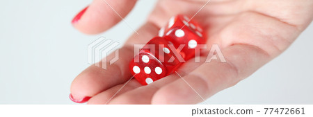 On hand are red dice with white marks 77472661