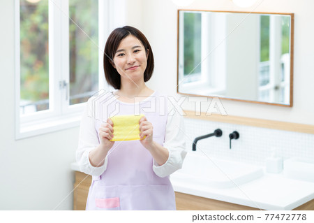 Cute lady cleaning Cute lady cleaning 77472778