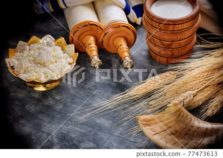 Jewish holiday Shavuot concept in the kosher dairy food on harvest season Jewish holiday Shavuot concept in the kosher dairy food on harvest season 77473613