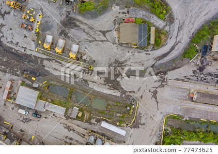 Panorama aerial view quarrying extractive industry big mining of machinery trucks open pit mine mining, dumpers stripping work 77473625