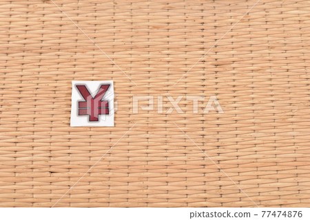 Yen symbol and wicker surface background 77474876