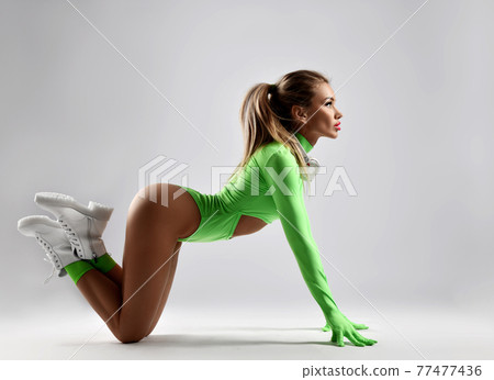 Sexy sporty blonde woman, fitness trainer in 77477436