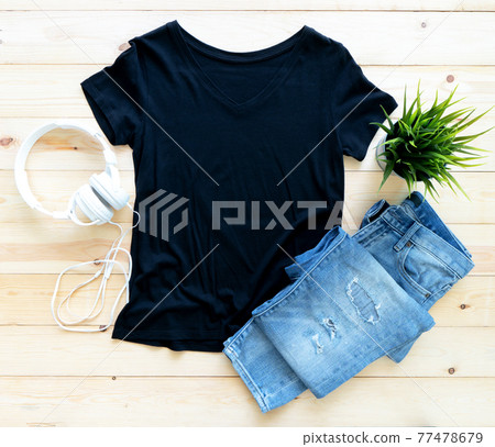 Black tshirt mockup and short jeans on brown wooden background. Template, flat lay, template Black tshirt mockup and short jeans on brown wooden background. Template, flat lay, template 77478679