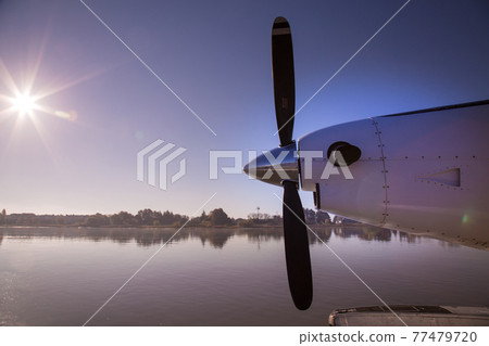 Airplane propeller sea surface sunshine beautiful nature Airplane propeller sea surface sunshine beautiful nature 77479720