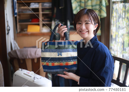 Woman with handmade bag 77480181