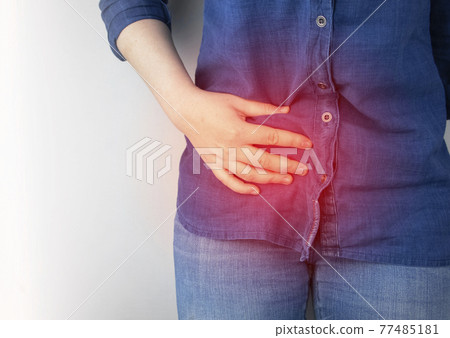 A woman suffers from pain in the appendix. Acute appendicitis, Crohn's disease, or inflammatory bowel disease. Surgeon examination and preparation for laparoscopic appendectomy A woman suffers from pain in the appendix. Acute appendicitis, Crohn's disease, or inflammatory bowel disease. Surgeon examination and preparation for laparoscopic appendectomy 77485181