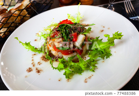 Cod timbale with roasted red peppers and arugula Cod timbale with roasted red peppers and arugula 77488386