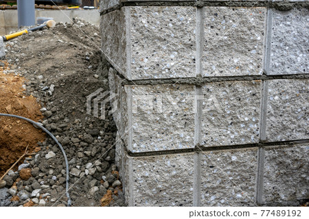 Exterior construction of a newly built single-family home Exterior construction site of a newly built single-family home (block stacking) Construction site (block stacking) Exterior construction of a newly built single-family home Exterior construction site of a newly built single-family home (block stacking) Construction site (block stacking) 77489192
