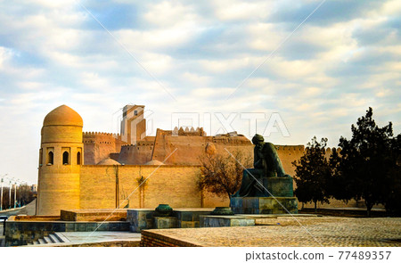 Exterior view to Ota-Darvoza gate and Statue of Muhammad ibn Musa al-Khwarizmi, Khiva, Uzbekistan 77489357