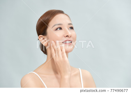 Cleansing young woman on blue background Cleansing young woman on blue background 77490677