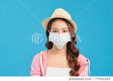 Woman wearing trendy spring, summer fashion outfit during quarantine of coronavirus outbreak. 77491093