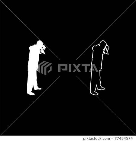 Man is blow one's nose into handkerchief tissue  77494574