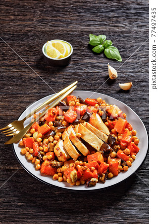 Salad of chickpea, butternut on a plate, top view 77497435