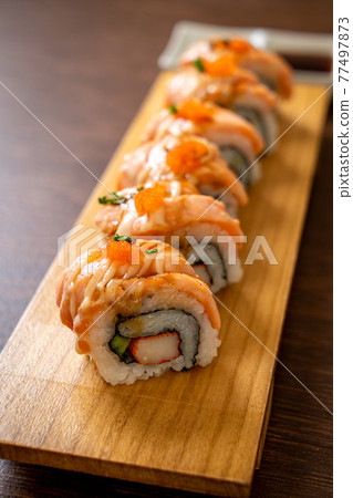 grilled salmon sushi roll with sauce grilled salmon sushi roll with sauce 77497873