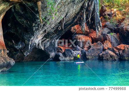 Tourists kayaking at Railay in Krabi, Thailand. 77499988