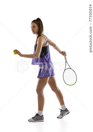 Young caucasian woman playing tennis isolated on white studio background in action and motion, sport concept Young caucasian woman playing tennis isolated on white studio background in action and motion, sport concept 77500854