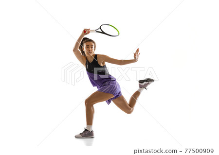 Young caucasian woman playing tennis isolated on white studio background in action and motion, sport concept 77500909