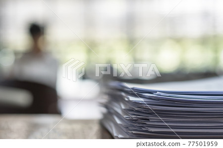 Exam answer sheet pile, blurry application document paperwork stack on office work table in examination room or classroom with blur education background school class university students taking test Exam answer sheet pile, blurry application document paperwork stack on office work table in examination room or classroom with blur education background school class university students taking test 77501959