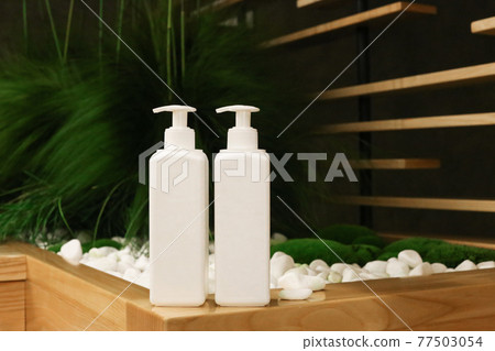 White Plastic dispenser bottles with body cream 77503054