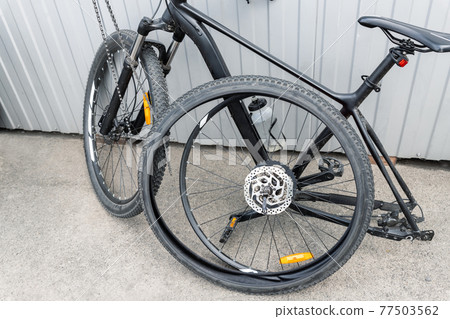 Disassembled black carbon fiber bicycle with Stock Photo