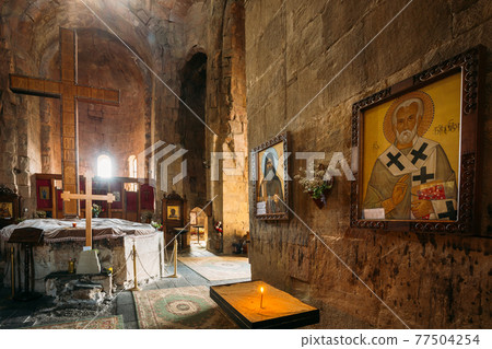 Mtskheta Georgia. Interior Of Jvari Church. Altar, Wooden Crosses, Icons On Stone Wall Mtskheta Georgia. Interior Of Jvari Church. Altar, Wooden Crosses, Icons On Stone Wall 77504254